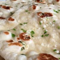Garlic Naan · Leavened bread topped with Garlic and cooked in a Clay oven