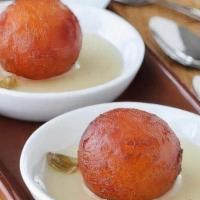 Gulab Jamun (2 Pcs Per Order) · Flour and Cottage cheese fried and soaked in a Saffron flavored sugar syrup.