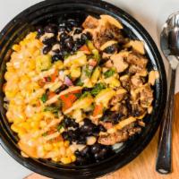 Jerk Bowl · Rice, black beans, corn, lettuce, onion, cilantro, tomatoes, jalapeno peppers, lime, cheese.