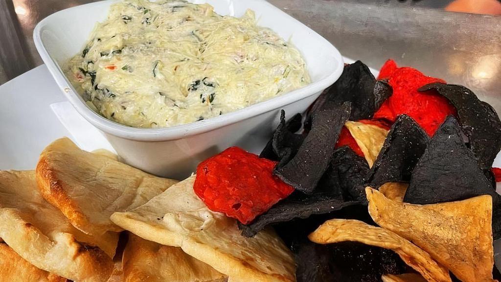 Spinach & Artichoke Dip · Served warm with Naan bread and Tortilla Chips