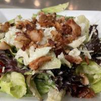 Moe'S House Salad · Five types of lettuce, cauliflower, bacon bits & Parmesan Cheese all mixed in our house dres...