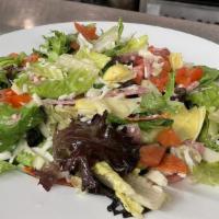 Antipasto Salad · Chopped Romain Lettuce mixed with sliced meats, provolone cheese, green & black olives, arti...