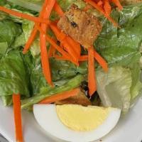 Classic Dinner Salad · Iceberg, Romain and Spring Greens topped withs shredded carrots, hard boiled egg, cherry tom...