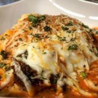 Chicken Parmigiana · Chicken Breast lightly breaded and sauteed in olive oil, then topped with our rosa sauce, mo...