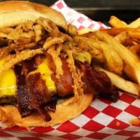 Jim Beam Burger · Our 7 oz. burger patty topped with JIm Beam Bourbon BBQ Sauce, smoked cheddar cheese, bacon ...