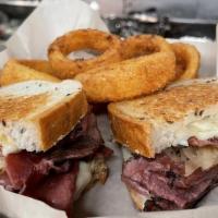 Ny Reuben · Thinly sliced pastrami, sauerkraut, Swiss Cheese and 1000 Island dressing on toasted Rye Bre...