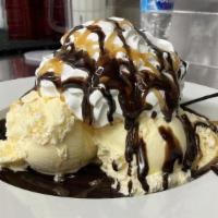 Messy Sundae · A giant sundae with vanilla ice cream, fudge, chocolate sauce, caramel sauce and whipped cre...