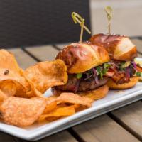 Farmhouse Burger · Pretzel bun, ground beef patty, Nueske’s maple bacon, goat cheese, microgreens, tomato jam
