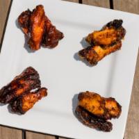 Square Mile Wings · 12 dry rubbed, oven baked chicken wings. Choose 1 to 4 of the following Ralston’s sauces: Ko...