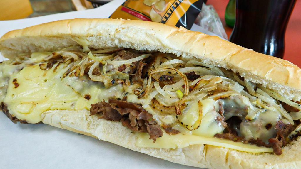 Cheese Steak Hoagie · White bread, beef or chicken, grilled onions and peppers, white American cheese.