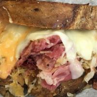 Reuben · Top menu item. Choice of corned beef, turkey or pastrami, grilled with Swiss, kraut and 1000...