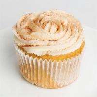 Peach Cobbler  · Our gourmet cinnamon brown sugar cupcake with peaches placed inside.