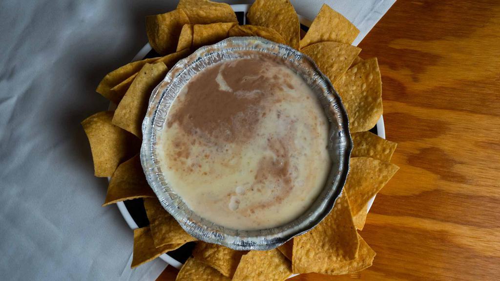 Bean Dip · Combination of beans and cheese dip.