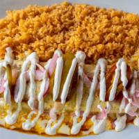 Burrito Cochinita · A flour tortilla filled with cochinita pibil (Mexican slow-roasted pork marinated in citrus ...