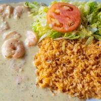 Camarones Blancos · Shrimp cooked with our own white sauce recipe. Served with Mexican rice, guacamole, lettuce,...