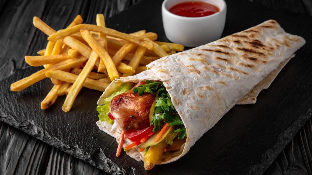 Beef Gyro · Juicy, marinated, thinly sliced, rotisserie beef, served in a soft pita with lettuce, onions, tomatoes and mayo.