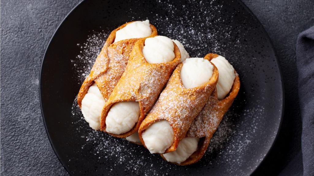 Cannoli · Delicate, fried pastry tubes filled with a sweet and creamy ricotta.