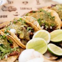 Tacos Street · Choice of meat, topped with onions & cilantro on a corn tortilla with lime. Add tripe or ton...