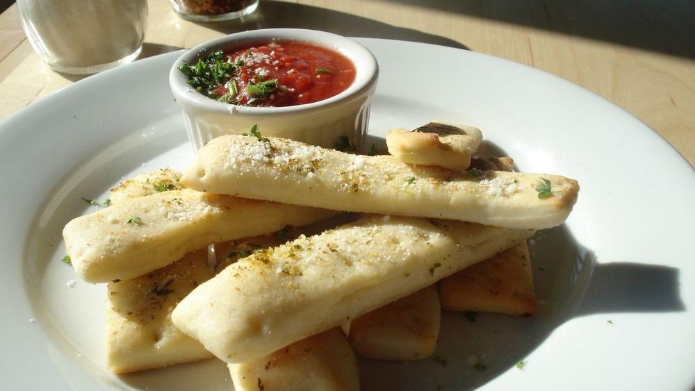 Breadsticks · Served with red sauce.