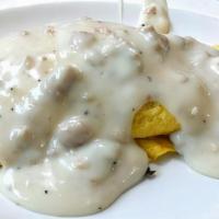Southern Omelette · Served with sausage, green peppers and onions, topped with sausage gravy.
