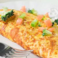 Veggie Omelette · Served with tomatoes, onions, green peppers, broccoli, mushrooms and cheddar cheese.