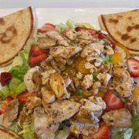 Strawberry Chicken · A House Favorite!  Chicken breast, strawberries, mandarin oranges and walnuts. Tossed with a...