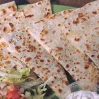 Quesadillas · Quesadillas tortilla filled with melted cheese and your choice of meat.