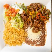 Pork Fajitas · Served with rice, beans, lettuce, guacamole, tomatoes, sour cream, rice and refried or black...