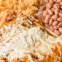 Meat Enchiladas · Rolled corn tortillas, filled with  choice of meat, covered with enchilada sauce, topped  wi...