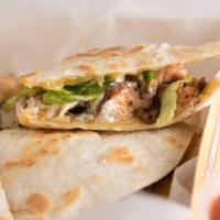 Quesadilla · Twelve inch flour tortilla, with choice of meat. Served with sour cream and lettuce.
