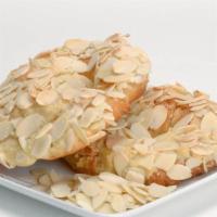 Almond Croissants · Croissants filled and topped with almond cream, finished off with slices of almonds.