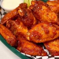 Wings · Tossed in your choice of sauce. Served with blue cheese or ranch dressing and celery. All bo...