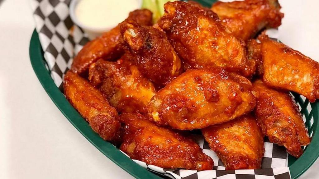 Wings · Tossed in your choice of sauce. Served with blue cheese or ranch dressing and celery. All bone-in wings are fried with the option to grill after for that grill flavor!