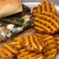 Philly Cheesesteak Sandwich · 6 oz. chopped steak served on a toasted French bread smothered with mozzarella cheese, green...