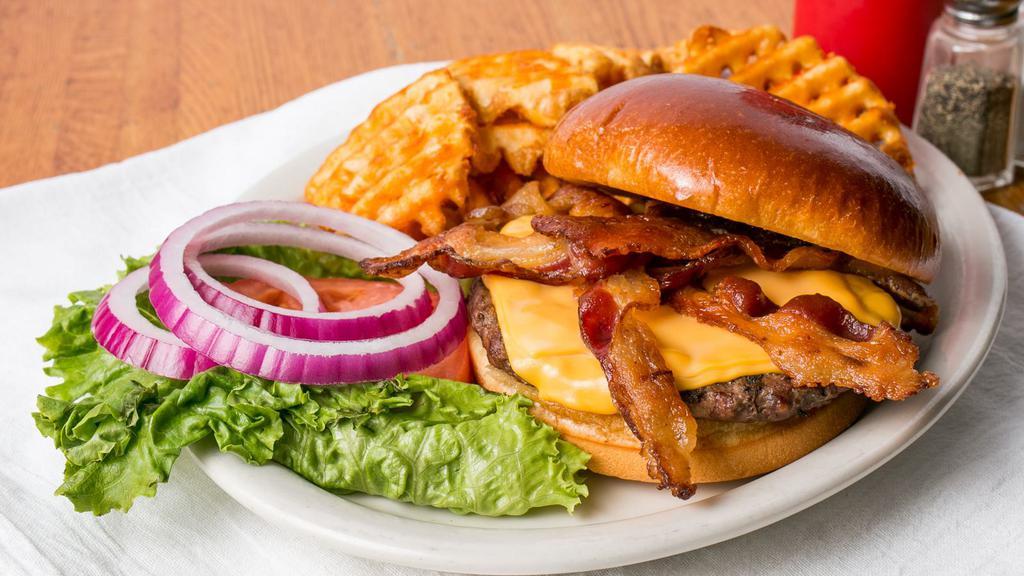 Cheeseburger · Angus patty served on a butter toasted bun with choice of cheese topped with lettuce, tomatoes, and onions.
