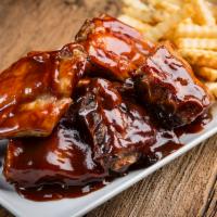 Full Slab Ribs · Full slab of ribs served with side salad and French fries. 2520 cal. per serving.