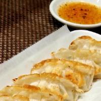 Gyoza · Fried chicken and pork dumplings (6 pieces), served with peppered ponzu sauce.