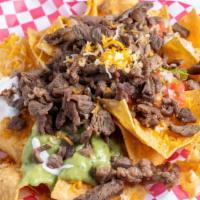 Half Super Nachos · Fried corn chips covered with shredded cheese and your choice of meat. Toppings include guac...