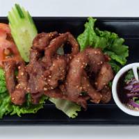 Fried Pork (Moo Dad Deaw) · Fried garlic pork served with home-made spicy chili sauce.