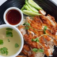 Thai Fried Chicken Rice (Kao Mun Gai Tod) · Crispy fried chicken over ginger rice, served with cucumbers, homemade sweet and sour sauce ...