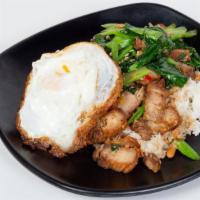 Crispy Pork Stir-Fried With Kai-Lan · Stir-fried crispy pork with Chinese broccoli, chili, onion, and bell peppers served with whi...