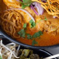  Curry Chicken Noodle (Khao Soi) · Egg noodles drenched in a creamy yellow coconut curry served with chicken thighs, green onio...