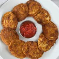 Fried Raviolis · Meat or cheese ravioli coated with egg and bread crumbs and fried. Served with homemade mari...