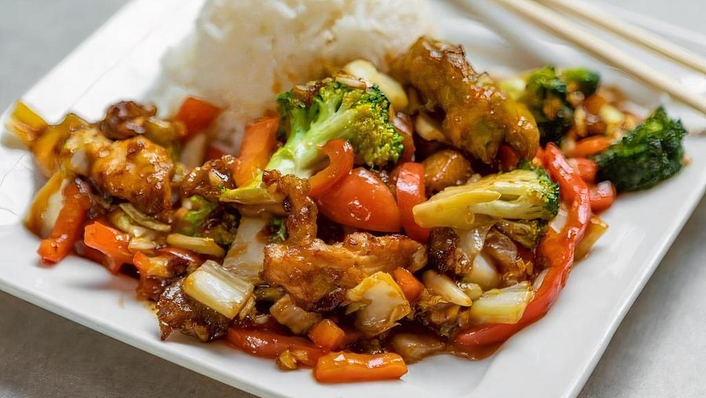 Rice Battered Chicken · Savory scallion chicken fried and coated in our mushroom soy sauce served over stir fried bell peppers and broccoli.