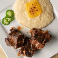 Beef Short Ribs · Smoked beef short ribs served with gouda grits.