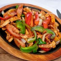 Fajitas Chicken · Chicken with grilled onions, bell pepper, tomatoes. Served with lettuce, sour cream, guacamo...