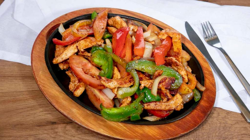 Fajitas Chicken · Chicken with grilled onions, bell pepper, tomatoes. Served with lettuce, sour cream, guacamole, pico de gallo, rice and beans. Served with rice, beans, house salad and tortillas.