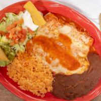 Enchiladas Suizas · Three corn tortillas rolled up and topped with red salsa and melted cheese, served with lett...