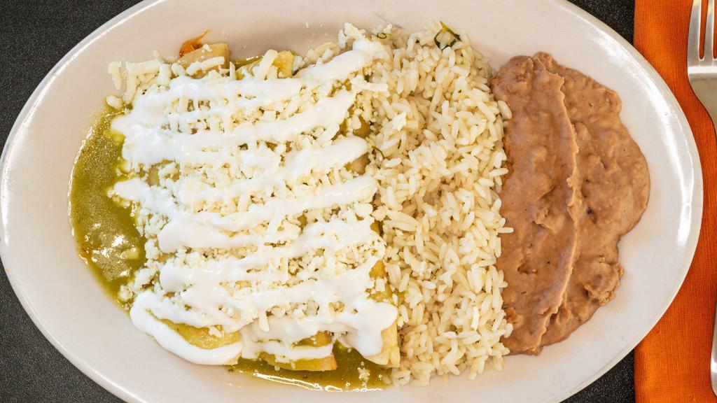 Enchiladas (3) · Vegetarian. Your choice of meat or cheese. Topped with sour cream and cheese in a green sauce. Side of rice and beans.