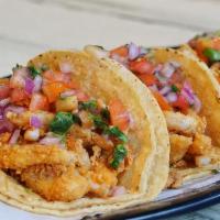 Fish Tacos (3) · Tilapia fish tacos on corn tortilla topped with pico de gallo.